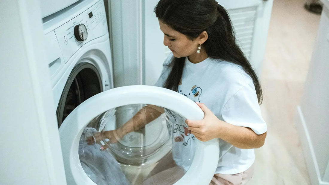 Woman using a washing machine