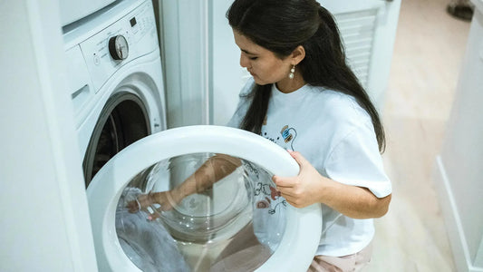 Woman using a washing machine