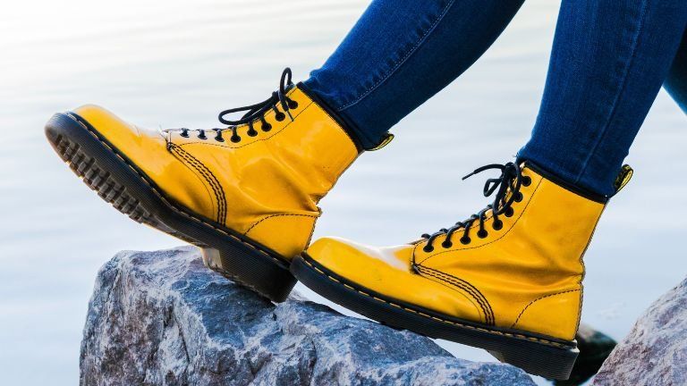 Yellow boots resting on a rock